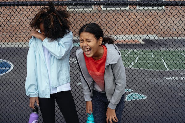 Two girls laughing